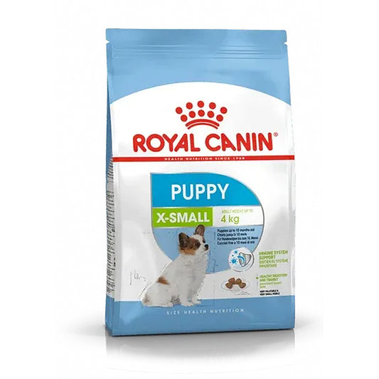 A 4 kg bag of Royal Canin Puppy X-Small dog food, featuring the brand's red logo and a picture of a small puppy on a light blue and white background.