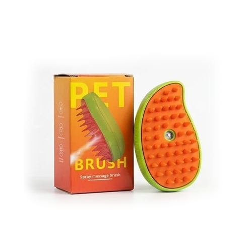 An orange and green pet spray massage brush shown next to its orange and yellow retail box on a white background.